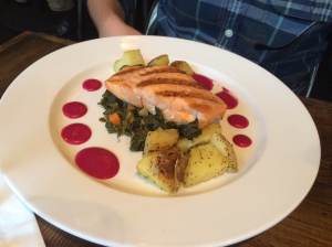 Salmon - grilled salmon, braised kale, garlic oil roasted potatoes, beet-coriander vinaigrette